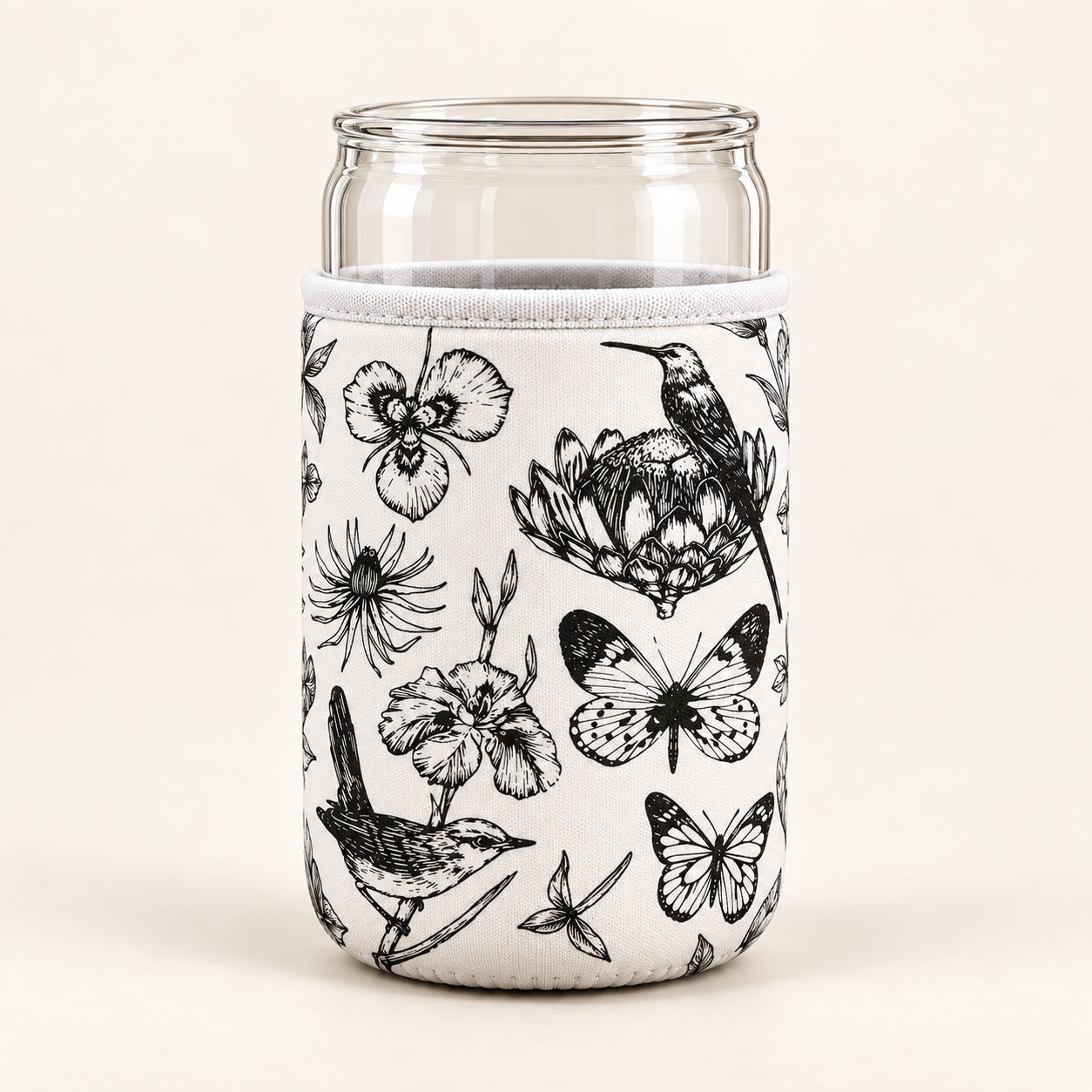 Product mockup of a cream can sleeve with black botanical, bird and butterfly drawings around a clear can-shaped vessel