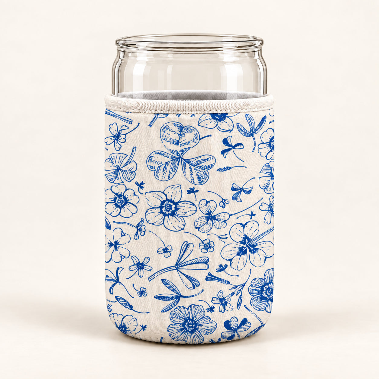 Product mockup of a cream can sleeve with blue botanical line drawings around a clear can-shaped vessel
